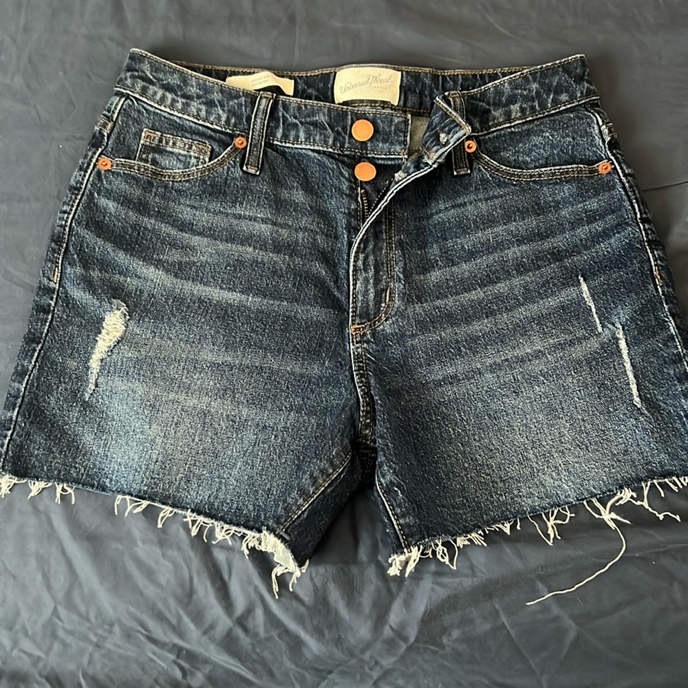 Universal thread dark wash cut offs